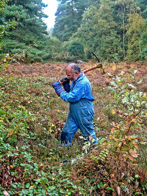 George Zachariah with mattock