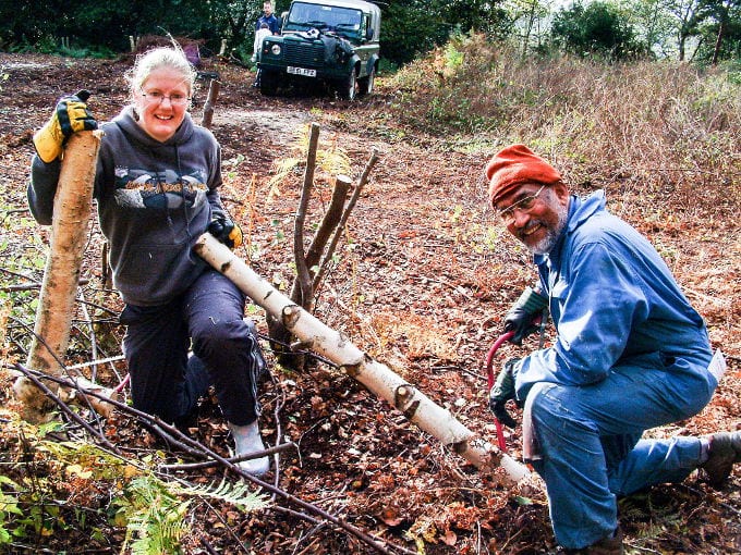 George Zachariah sawing log