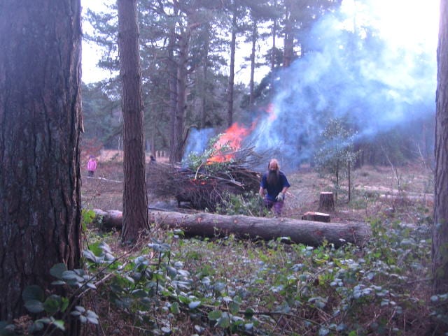 Tibor tending bonfire